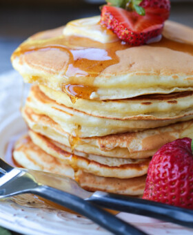 stack of pancakes with syrup dripping down