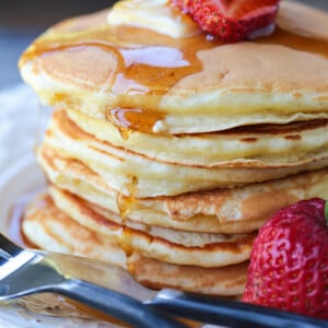 stack of pancakes with syrup dripping down