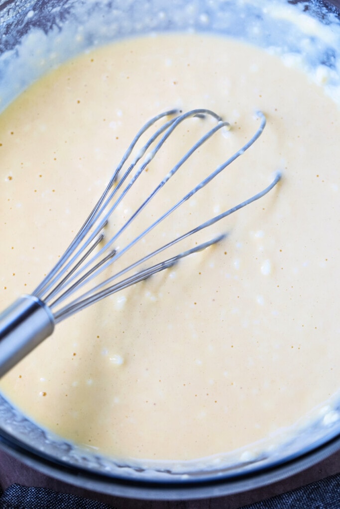 pancake batter in bowl with whisk