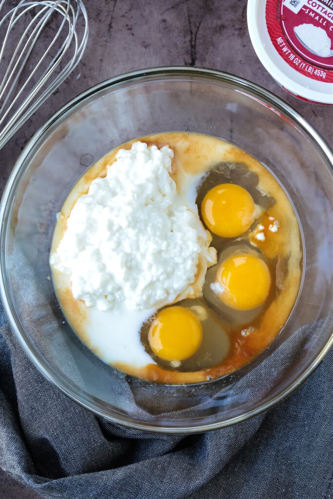 eggs and cottage cheese in a bowl for making pancakes