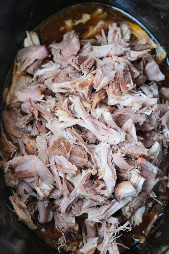 Dr. Pepper Pulled Pork is sweet, savory and crazy delicious. Classic cherry soda caramelizes and tenderizes this addicting slow cooker pork! shredded pulled pork in slow cooker