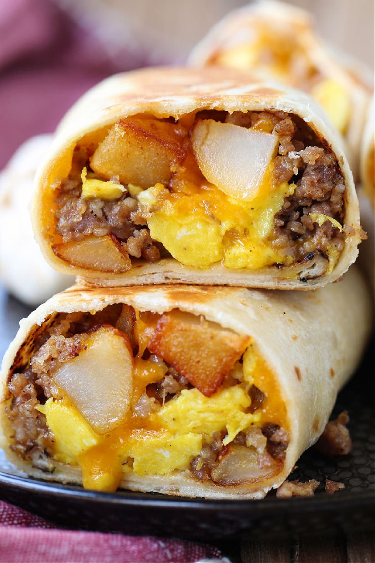 breakfast burritos cut in half and stacked