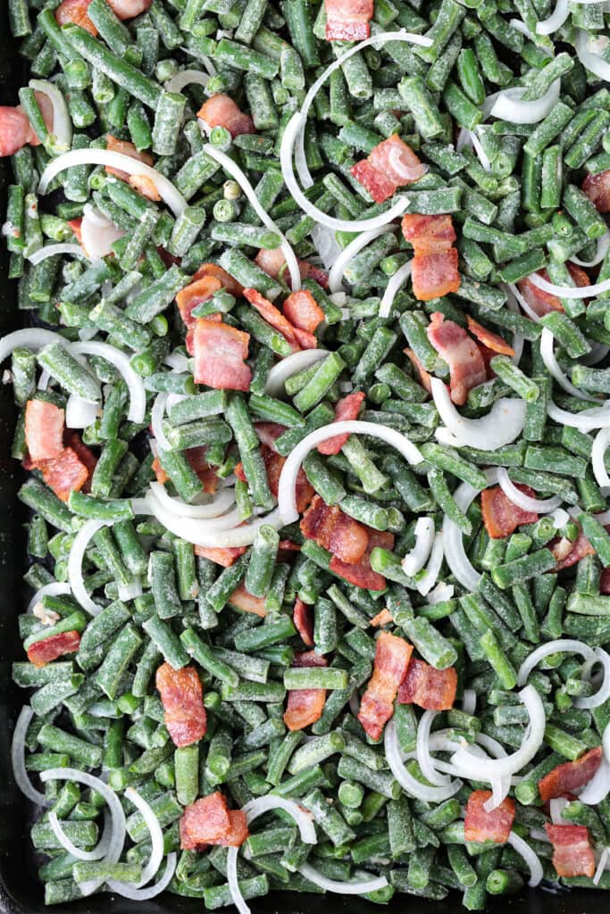 green beans, bacon and onions on a sheet pan