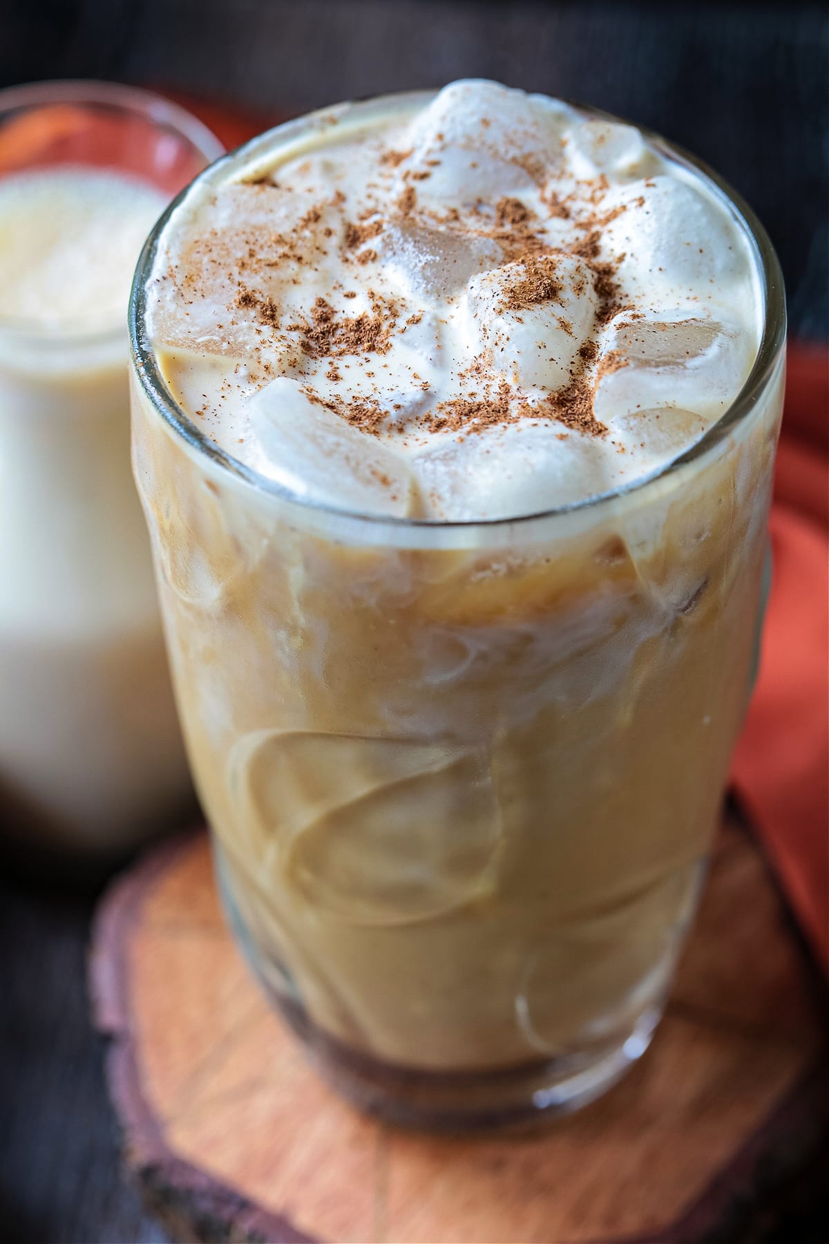 iced pumpkin cold brew in glass with spice on top