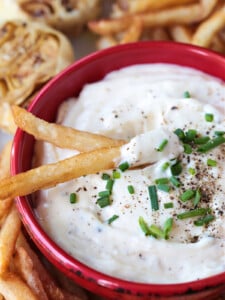 french fries dipped in garlic aioli