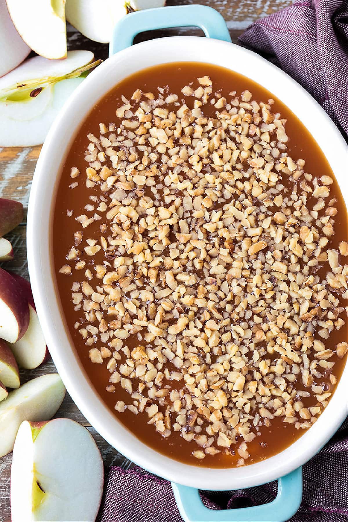caramel apple dip with chopped walnuts on top