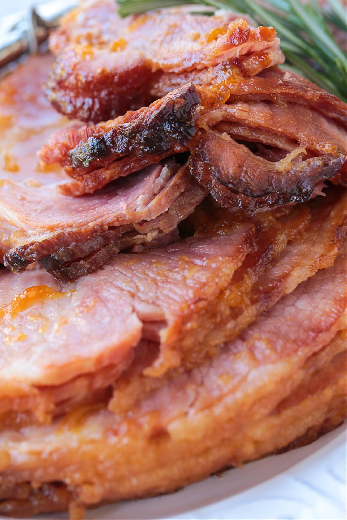 sliced spiral ham with glaze on a platter