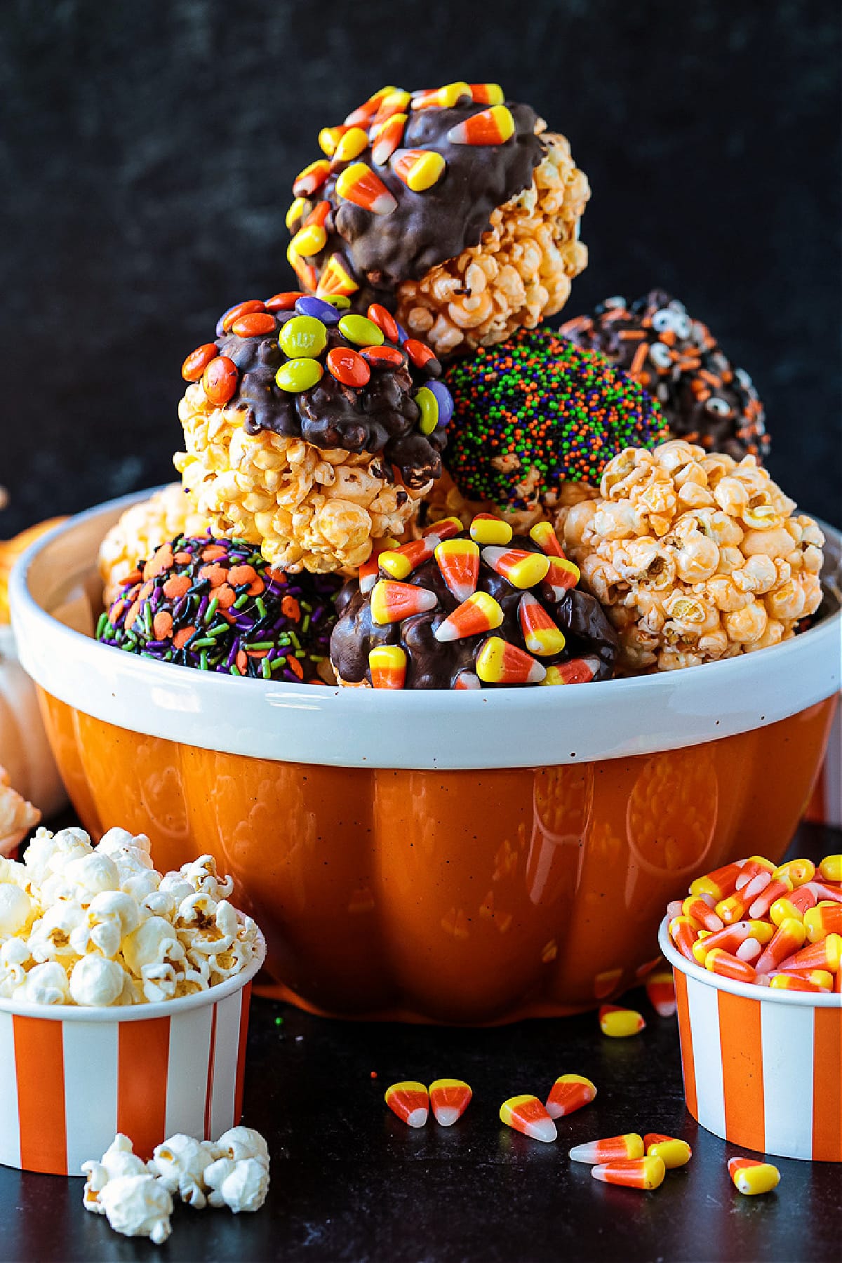 popcorn ball decorated in Halloween candy