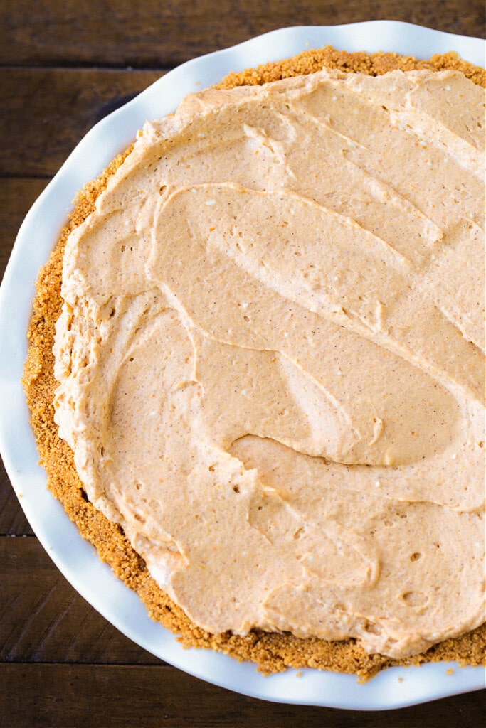 whipped pumpkin topping in a pie crust