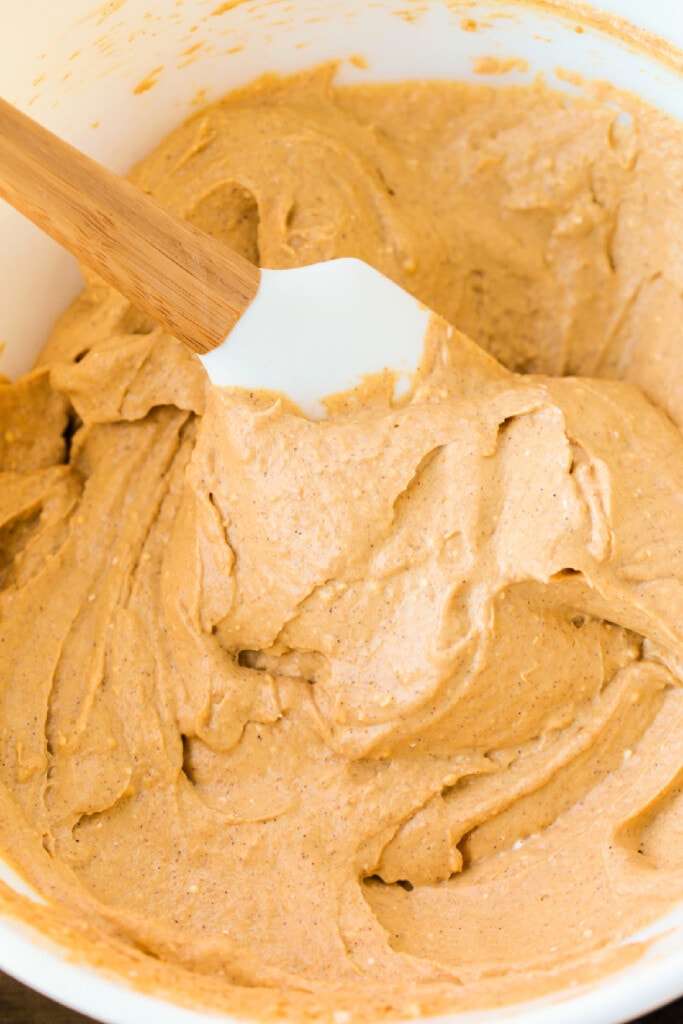 whipped pumpkin topping in a bowl with spatula