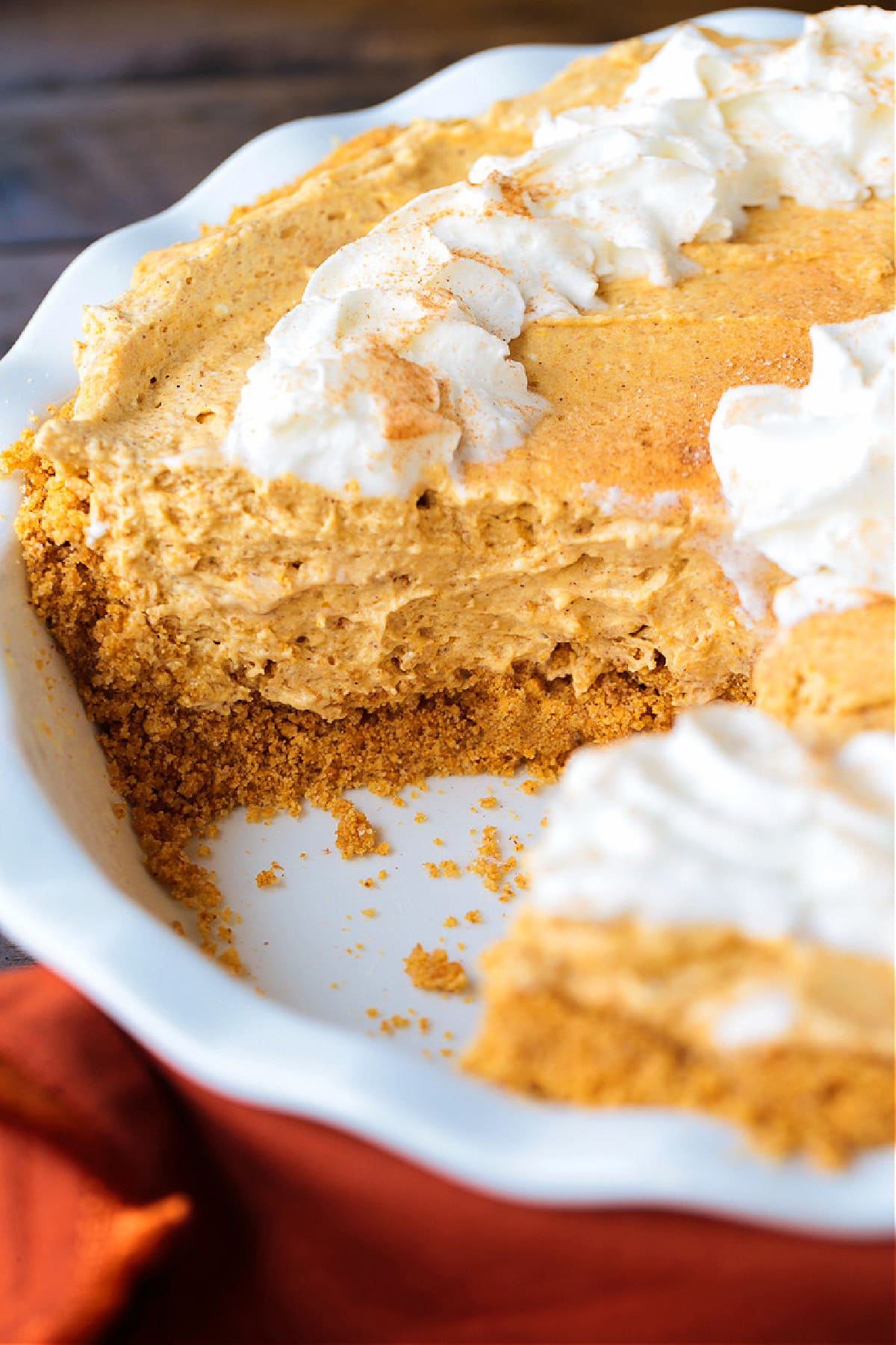 no bake pumpkin pie with a slice cut out