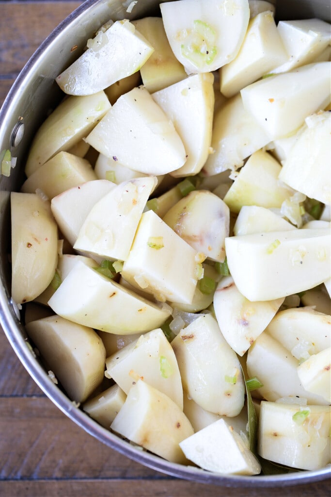 diced potatoes in a pot with onions and celery
