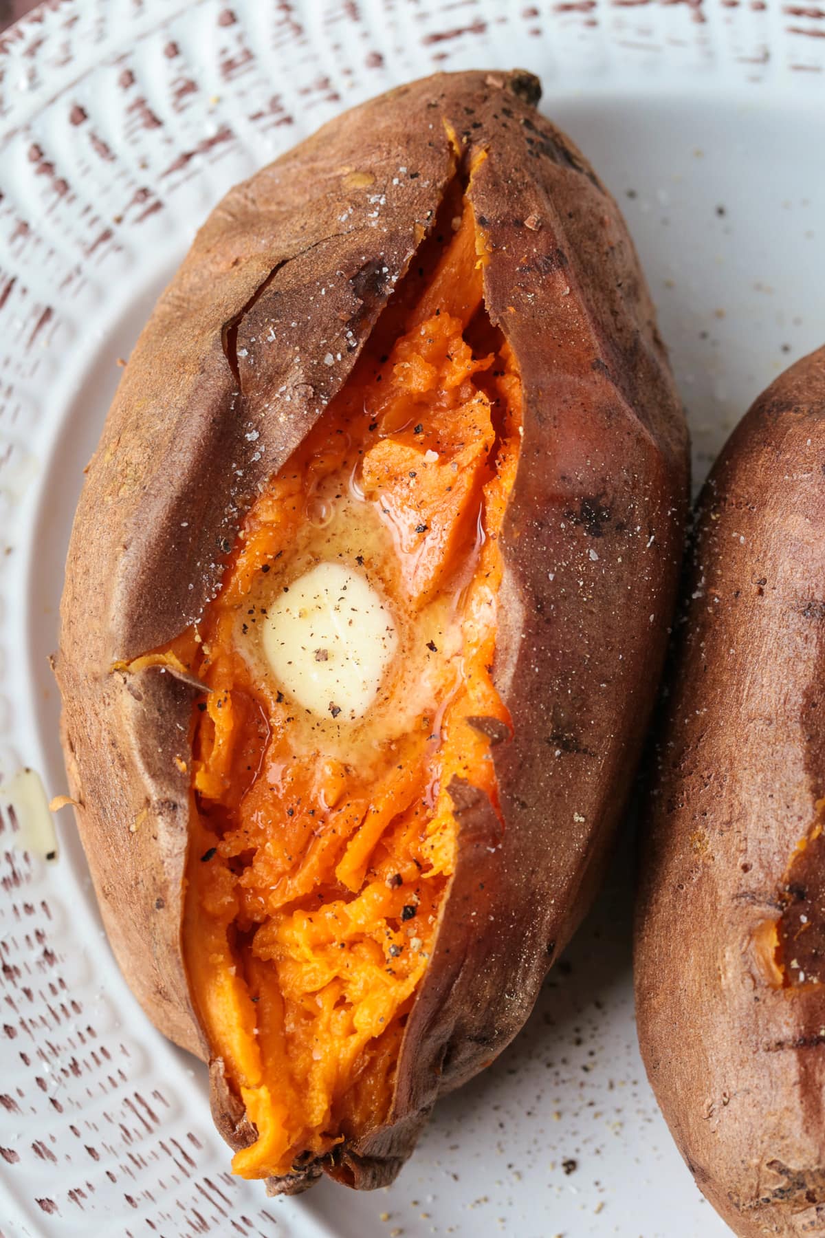 sweet potato cut down the middle with butter