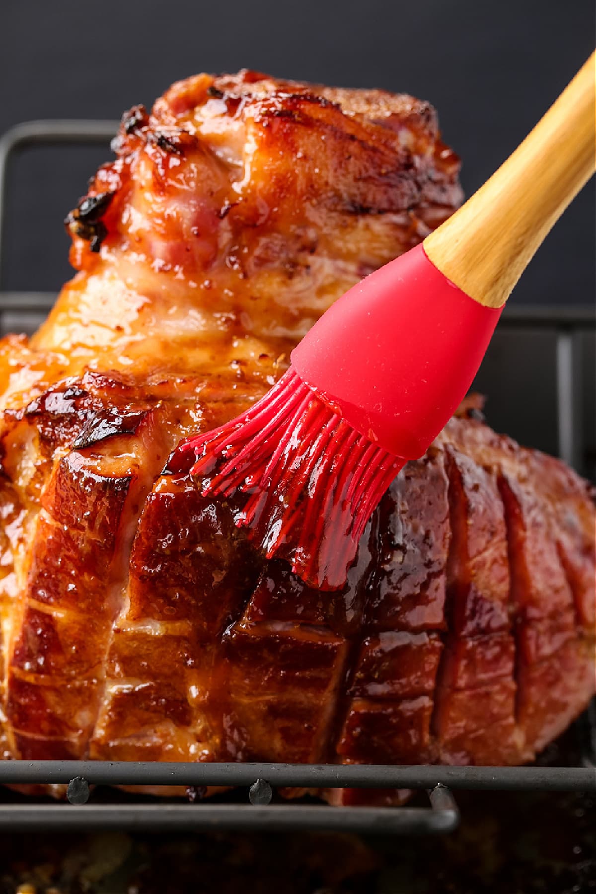 brushing glaze on baked ham