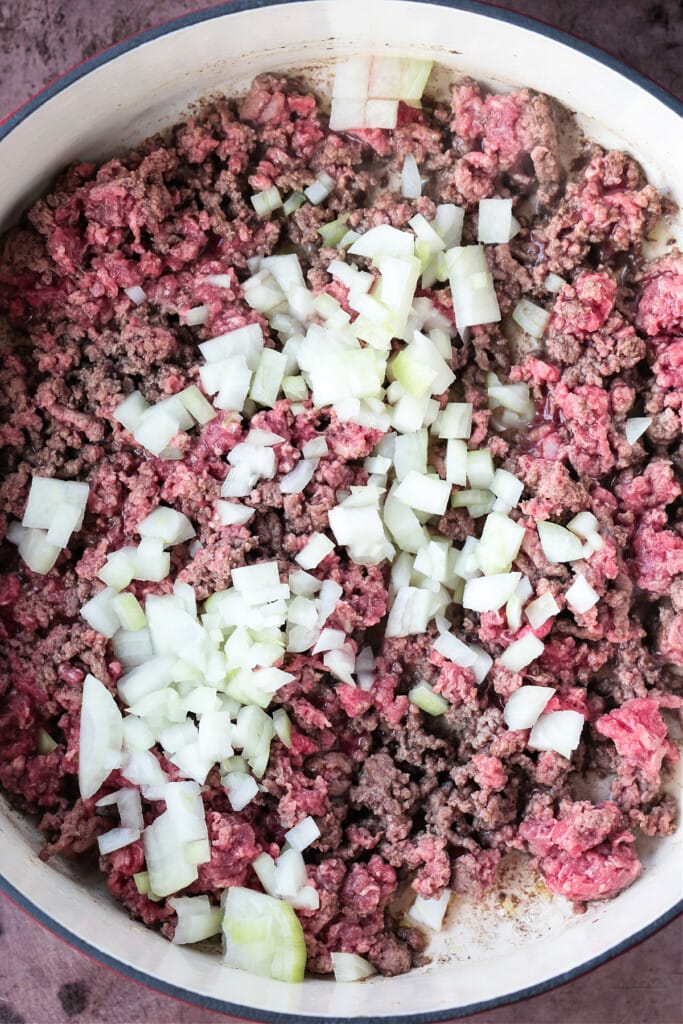 This Deconstructed Lasagna recipe is so much easier than making a traditional lasagna! All the same flavors you love, ready in 30 minutes. ground beef in pot with onions