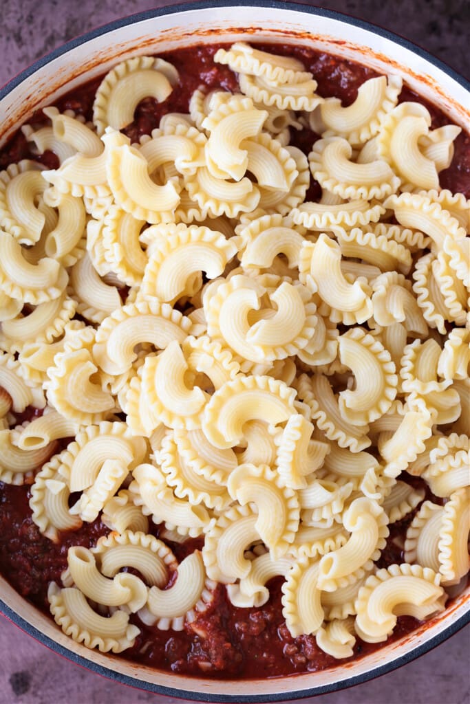 pasta in a pot with ground beef and sauce