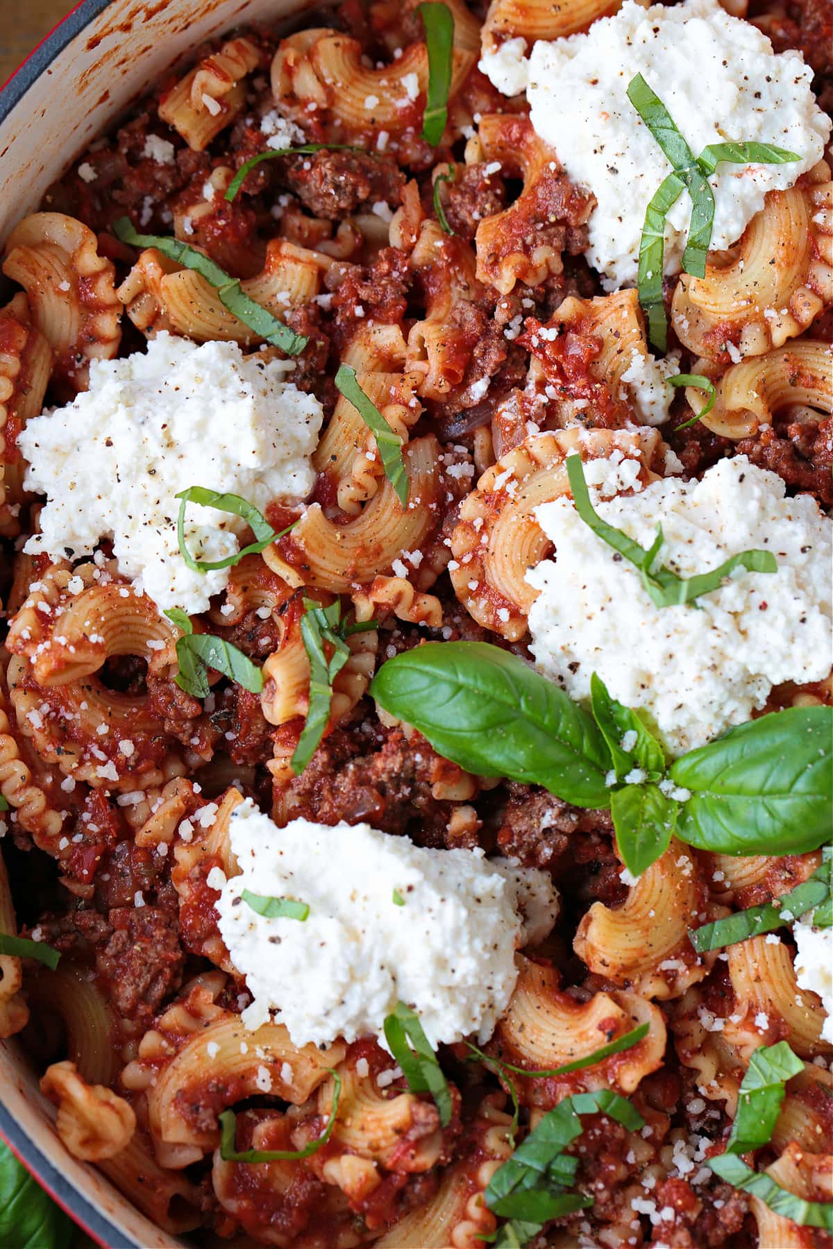 pasta recipe made with ground beef, tomato sauce and dollops of ricotta cheese