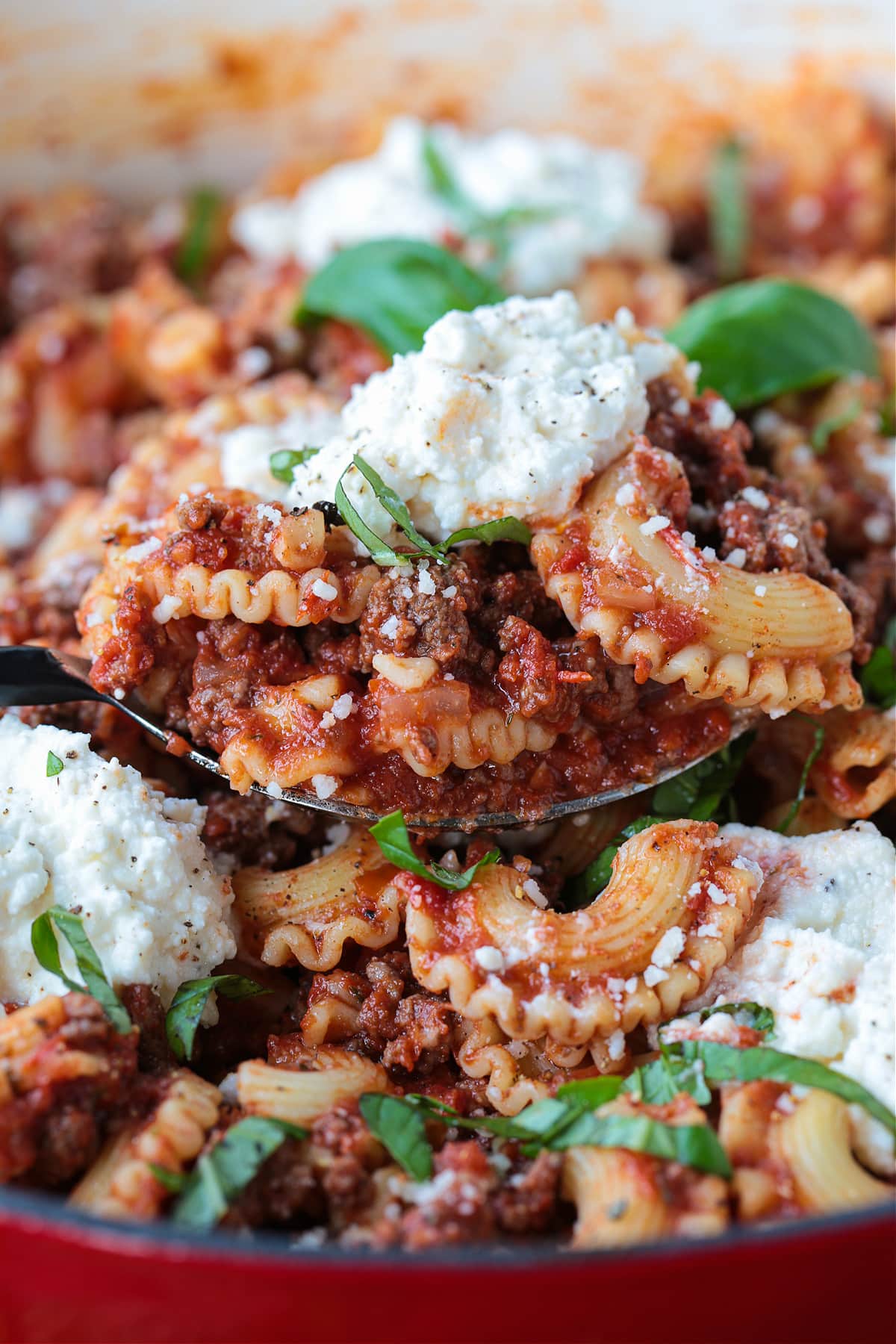 This Deconstructed Lasagna recipe is so much easier than making a traditional lasagna! All the same flavors you love, ready in 30 minutes. deconstructed lasagna recipe on a serving spoon