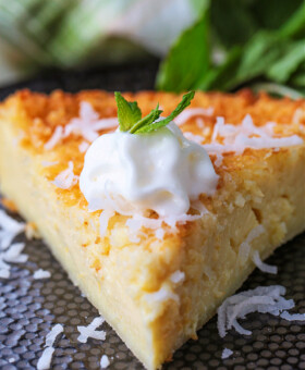 slice of coconut pie with whipped cream and mint