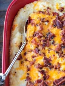 loaded mashed potato casserole with serving spoon