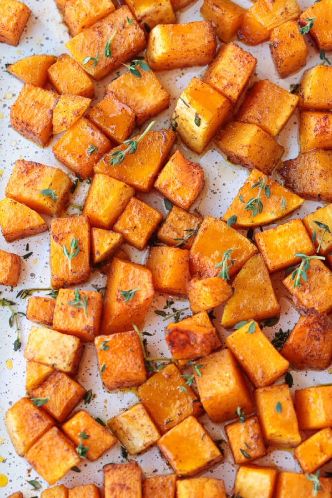 This simple Roasted Butternut Squash is so full of flavor. An easy side dish that goes with just about any dinner, especially a holiday meal! roasted butternut squash with fresh thyme