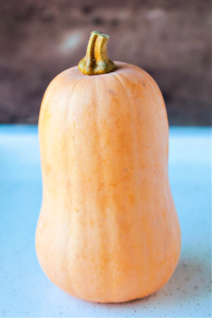 This simple Roasted Butternut Squash is so full of flavor. An easy side dish that goes with just about any dinner, especially a holiday meal! whole butternut squash