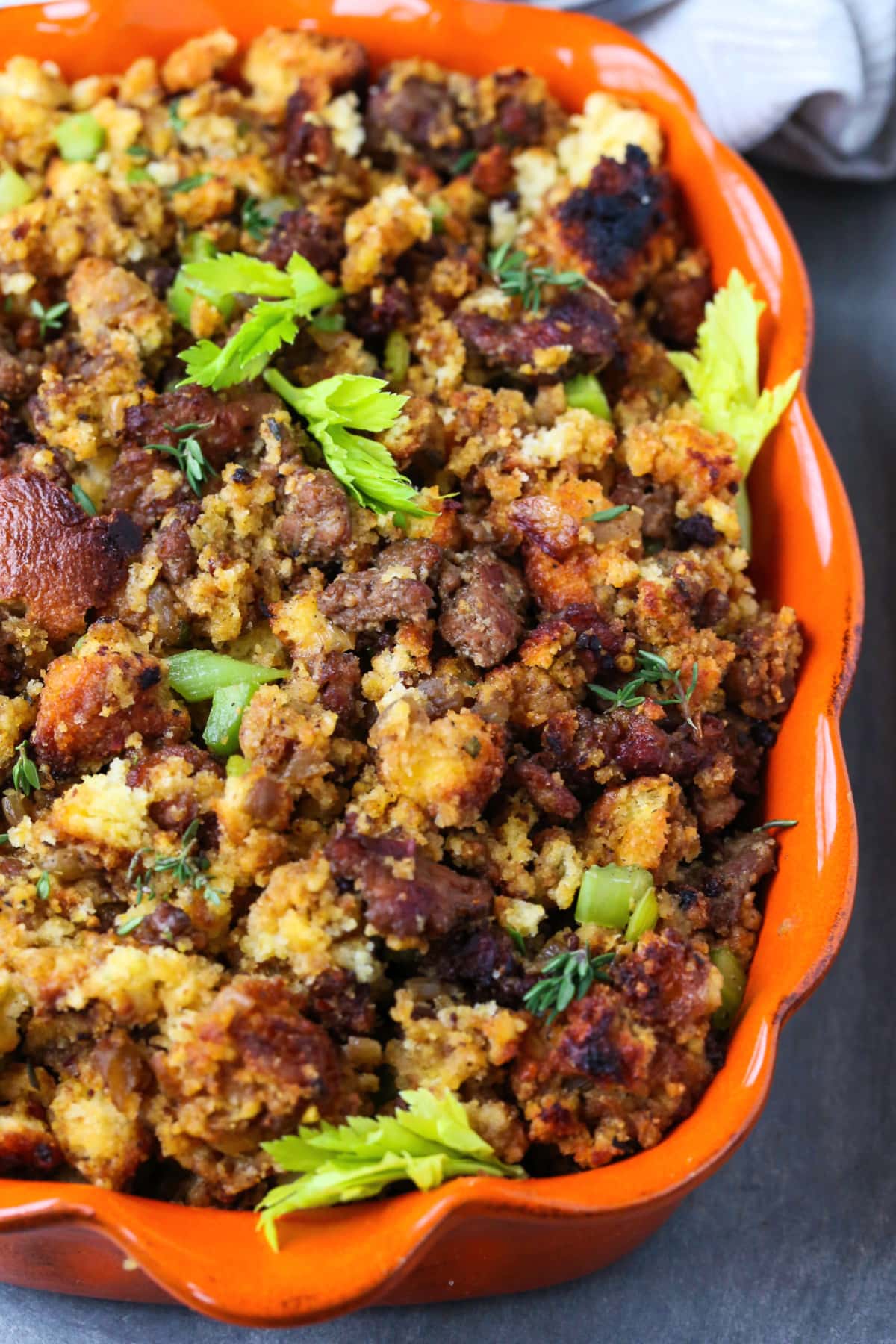 sausage cornbread dressing in orange baking dish