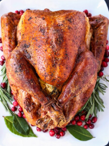 whole roasted turkey on white platter