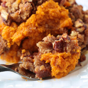 sweet potato souffle in white plate with fork