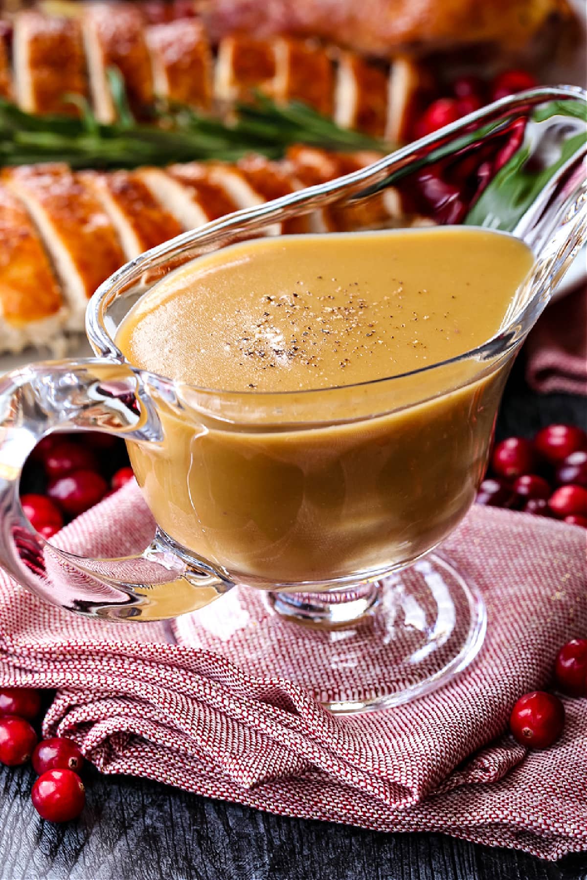 Make a Hot Turkey Sandwich with your leftover turkey! This tasty, open faced sandwich is our favorite way to use up Thanksgiving leftovers! turkey gravy in glass gravy boat