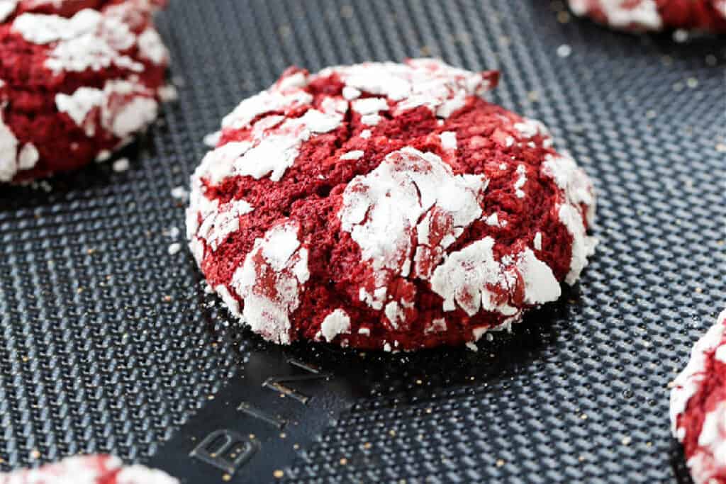 crinkle cookies baked on a cookie sheet