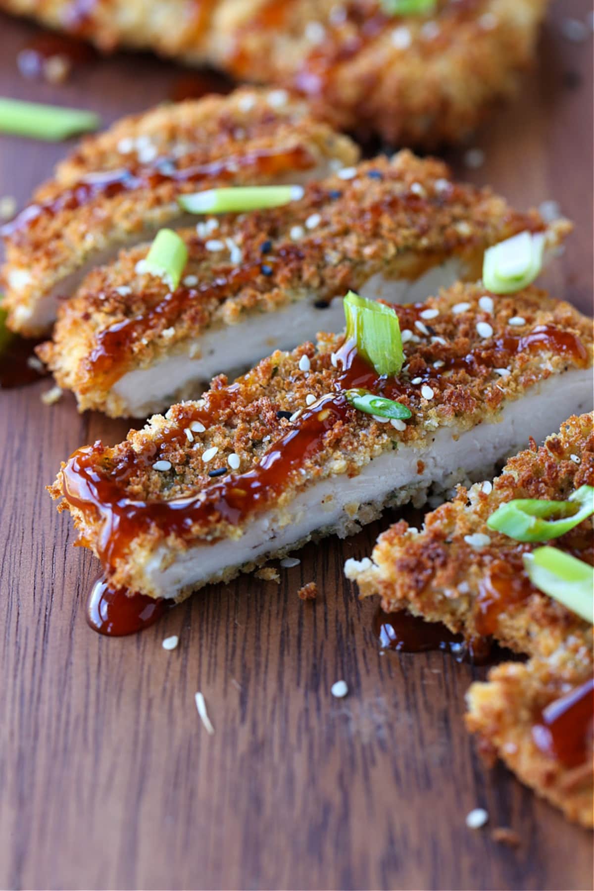 Air Fryer Chicken Katsu tastes as good as the fried version! Slice and drizzle with Asian BBQ sauce (Tonkatsu) and serve on a bed of rice. crispy chicken katsu drizzled with sauce