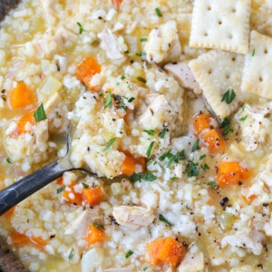 chicken pastina soup in a bowl with spoon