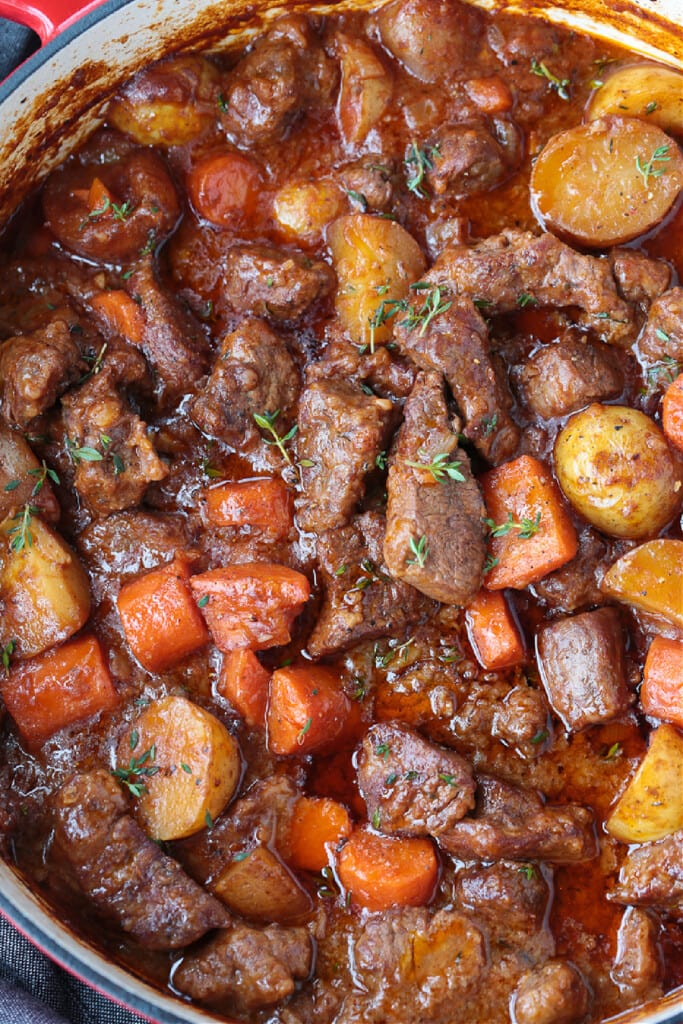 Our Easy Beef Stew is sure to become a family favorite! Tender pieces of beef and vegetables simmered in a red wine and beef gravy. beef stew in pot after cooking