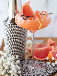 French blonde cocktail in coupe glass with grapefruit garnish