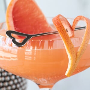 French blonde cocktail in coupe glass with grapefruit garnish