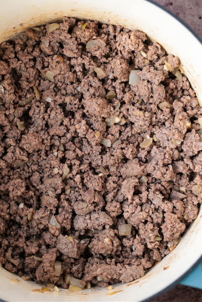 cooked ground beef in a pot for making chili