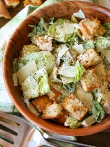 caesar salad in wooden bowl