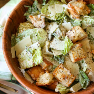 caesar salad in wooden bowl