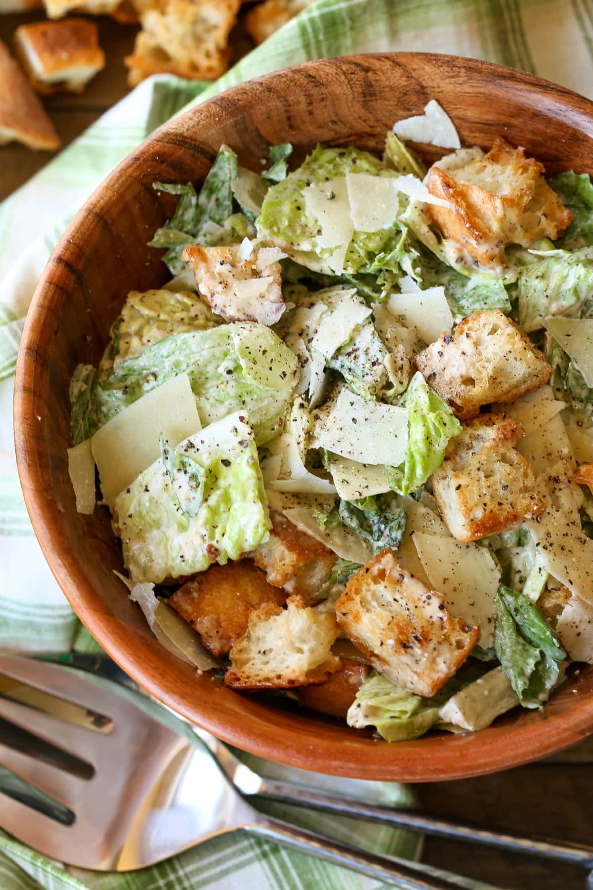 The BEST Creamy Caesar Salad Dressing ever. A secret ingredient makes our dressing stand out from the rest, you'll never need another recipe. caesar salad in wooden bowl
