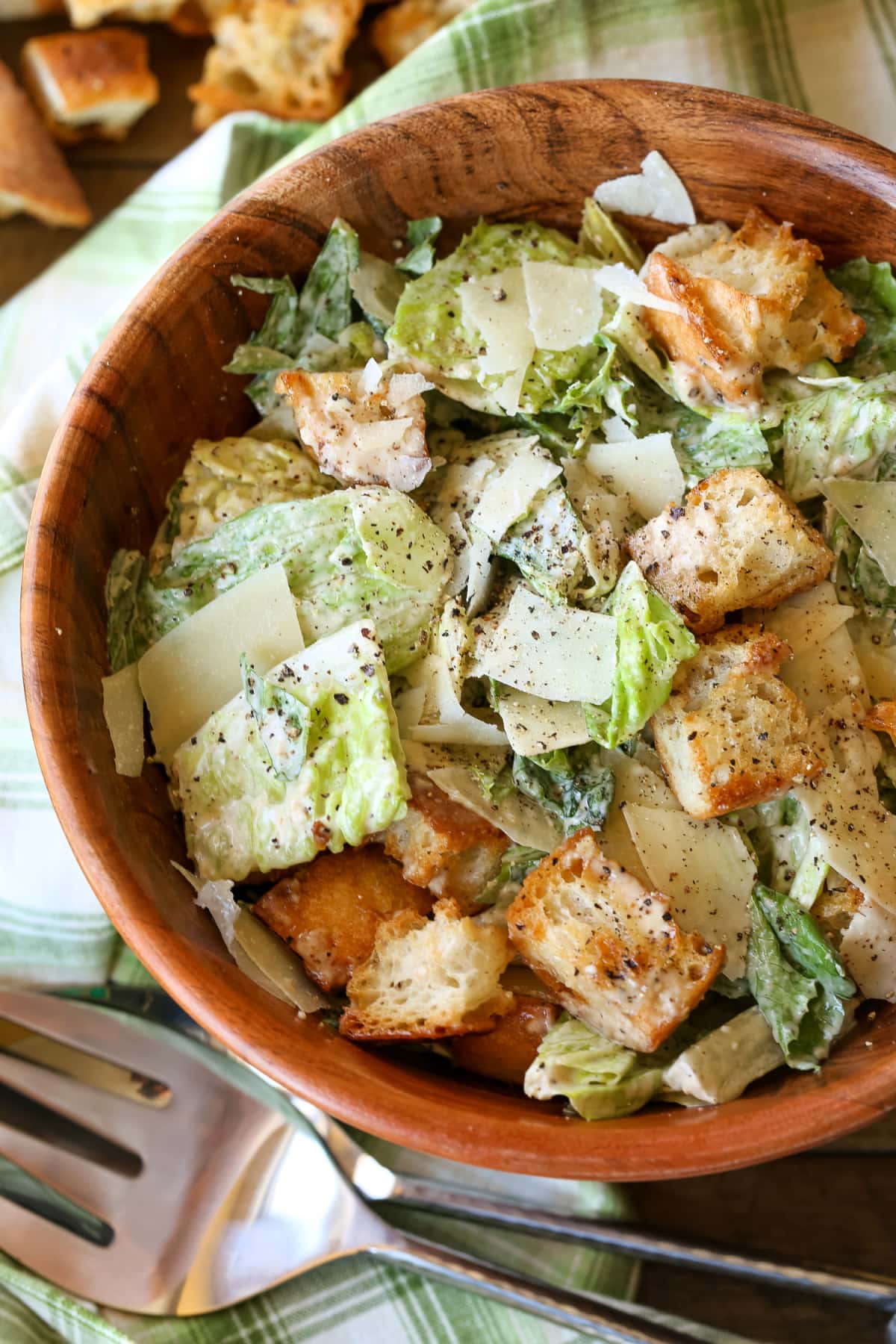 caesar salad in wooden bowl