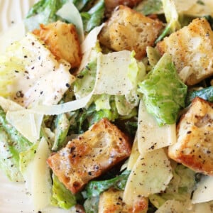 caesar salad on white plate with croutons