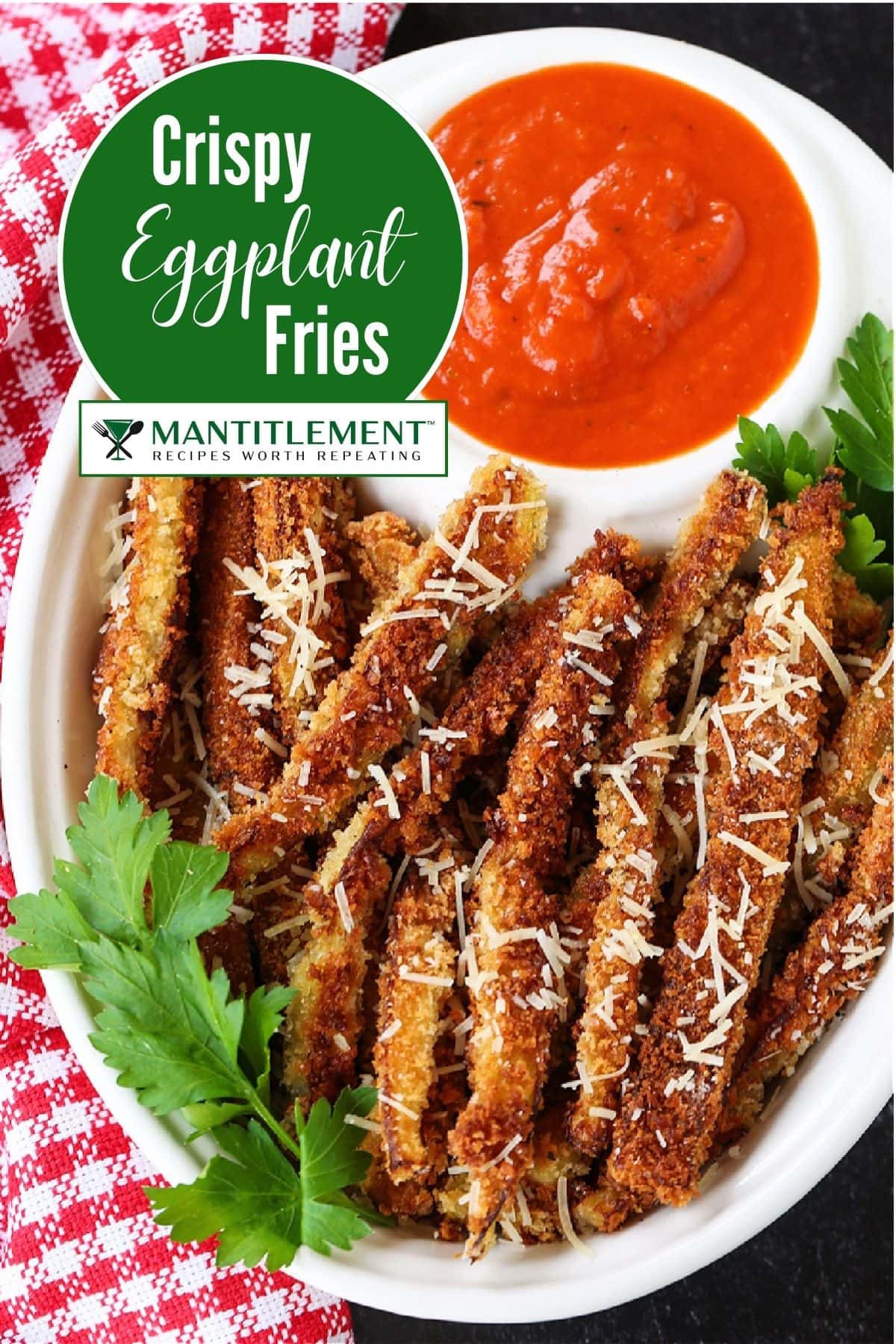 Crispy Eggplant Fries are so addicting! Breaded, lightly fried eggplant strips topped with parmesan cheese and dipped into marinara sauce. image of eggplant fries in a bowl with sauce for pinterest