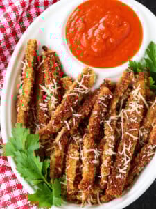 eggplant fries on a platter with marinara sauce