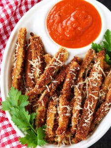 eggplant fries on a platter with marinara sauce