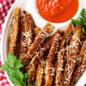 eggplant fries on a platter with marinara sauce