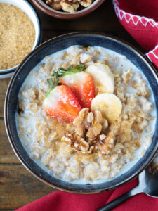 oatmeal in a bowl with toppings and red napkin on the side