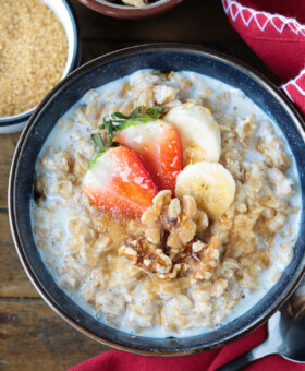 oatmeal in a bowl with toppings and red napkin on the side