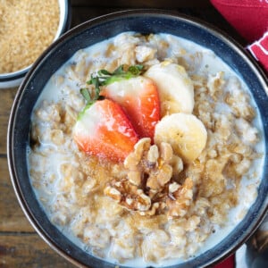 oatmeal in a bowl with toppings and red napkin on the side