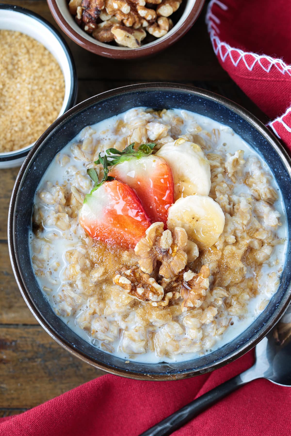 oatmeal in a bowl with toppings and red napkin on the side